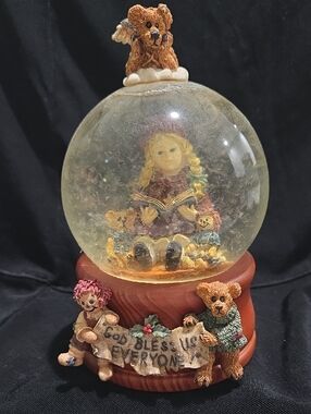 Yesterdays' Child Musical Snow Globe featuring "Megan & Clarence the Angel". 